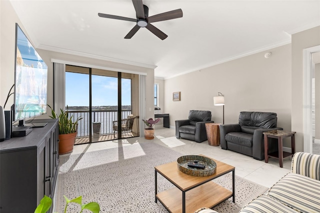 living room featuring baseboards, a ceiling fan, and crown molding