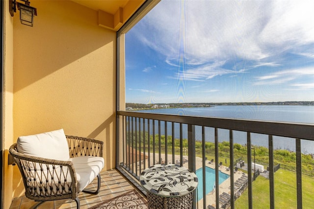 balcony featuring a water view