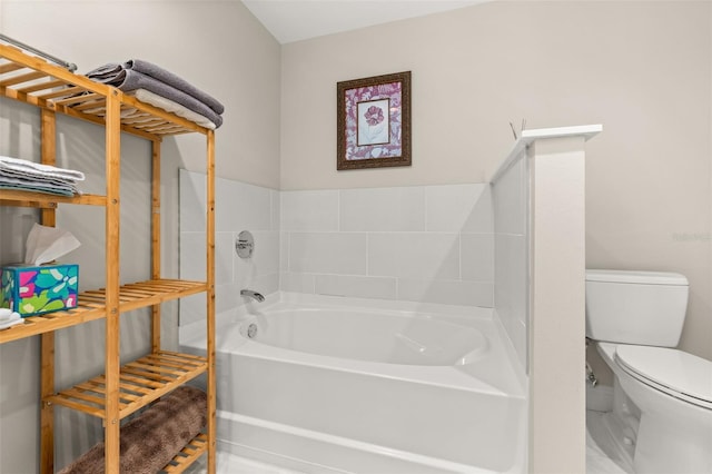 full bathroom featuring a garden tub and toilet