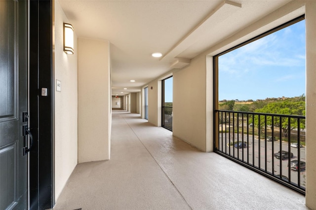 hall featuring concrete flooring