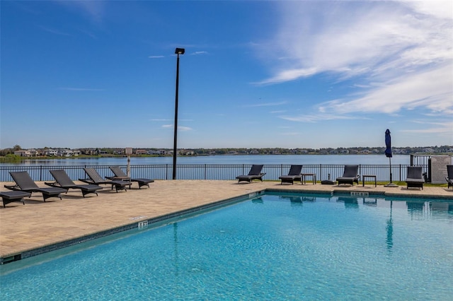 pool featuring a patio area and fence