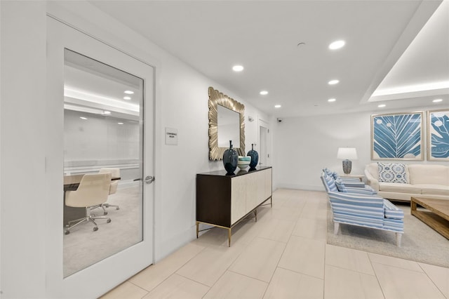 living area featuring recessed lighting, tile patterned flooring, and baseboards