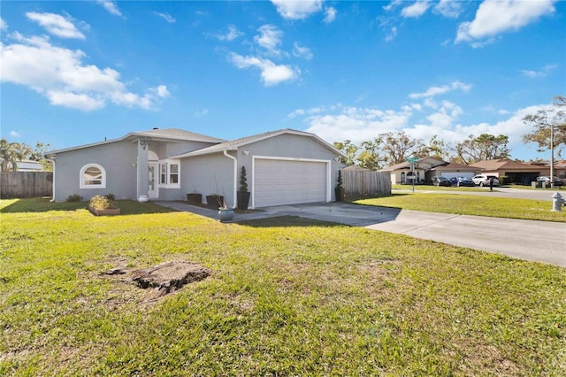 view of front of house with a garage, concrete driveway, fence, and stucco siding