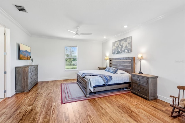 bedroom with crown molding, recessed lighting, visible vents, light wood-style floors, and baseboards