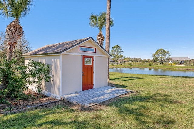 view of shed with a water view