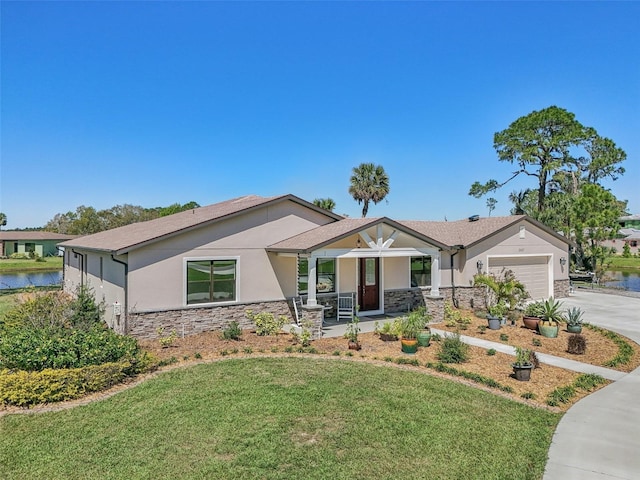 view of front facade featuring concrete driveway, stone siding, stucco siding, an attached garage, and a front yard