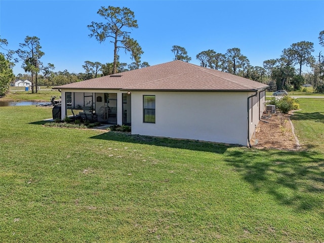 view of property exterior with a yard and stucco siding