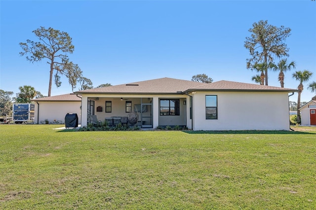 3607 Hidden River Ln, Tavares, FL 32778 - back of house featuring stucco siding, a yard, ceiling fan, and a sunroom