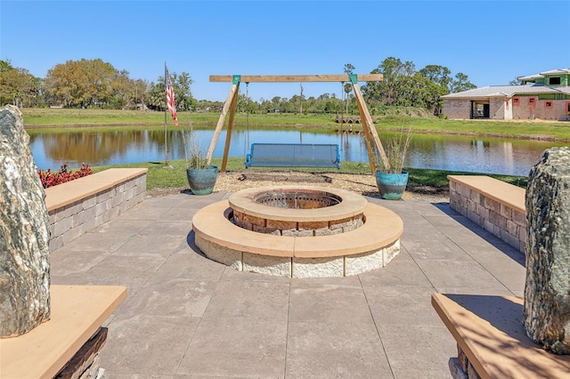 3607 Hidden River Ln, Tavares, FL 32778 - view of patio with an outdoor fire pit and a water view