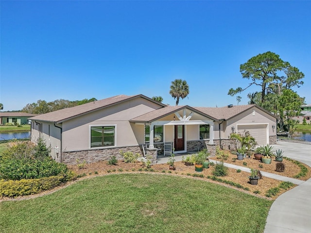 3607 Hidden River Ln, Tavares, FL 32778 - view of front of home with stone siding, a porch, stucco siding, and driveway