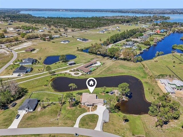 3607 Hidden River Ln, Tavares, FL 32778 - aerial overview of property's location featuring a nearby body of water and nearby suburban area
