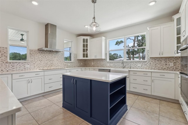 3607 Hidden River Ln, Tavares, FL 32778 - kitchen with wall chimney exhaust hood, plenty of natural light, black electric stovetop, light countertops, and recessed lighting