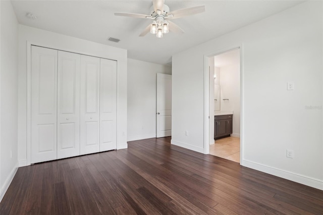 3607 Hidden River Ln, Tavares, FL 32778 - unfurnished bedroom featuring a closet, wood finished floors, baseboards, and a ceiling fan