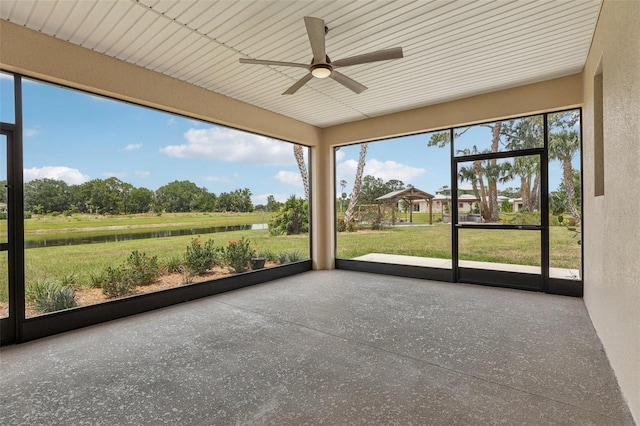 3607 Hidden River Ln, Tavares, FL 32778 - unfurnished sunroom with ceiling fan, a water view, and plenty of natural light
