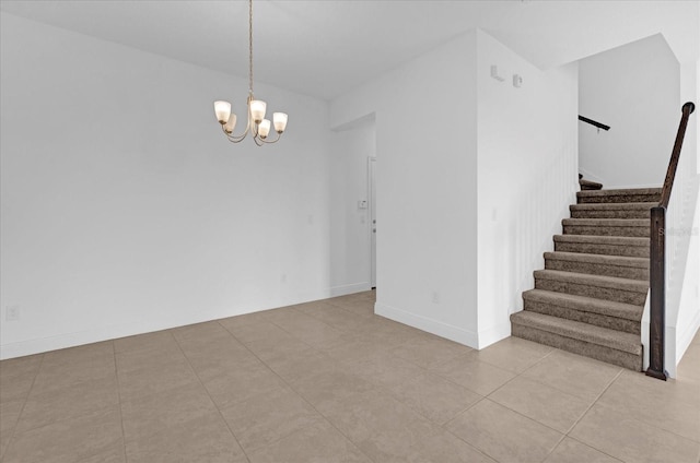 spare room featuring light tile patterned floors, stairway, baseboards, and an inviting chandelier