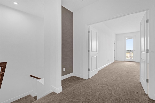 hall with carpet floors, recessed lighting, an upstairs landing, and baseboards