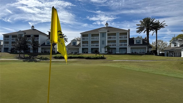 view of property's community with a lawn