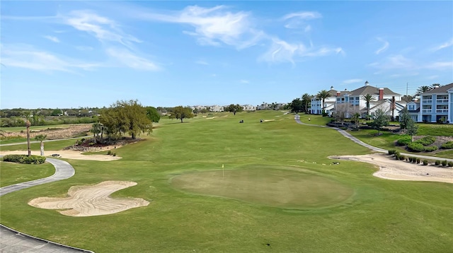 view of home's community featuring view of golf course