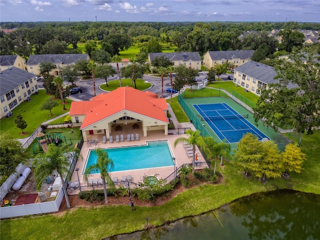 birds eye view of property featuring a view of trees