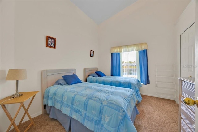 bedroom featuring carpet floors, high vaulted ceiling, and baseboards