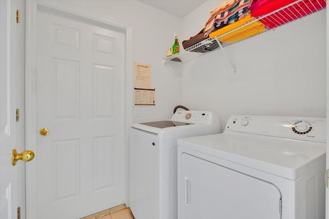 washroom featuring laundry area and independent washer and dryer