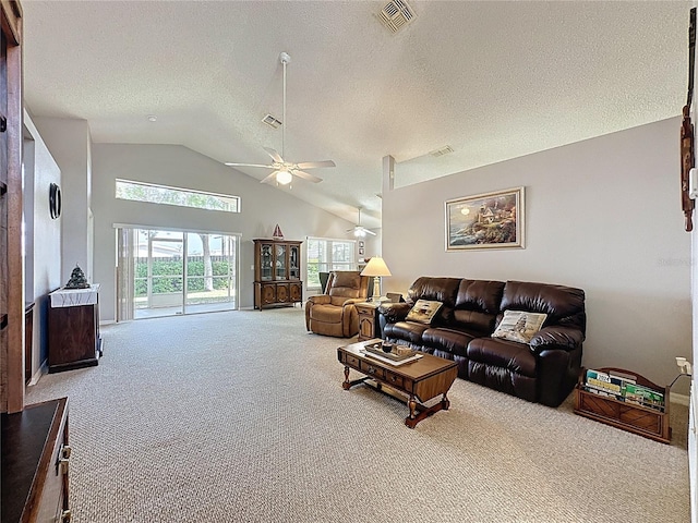 living room featuring visible vents, high vaulted ceiling, a ceiling fan, a textured ceiling, and carpet flooring