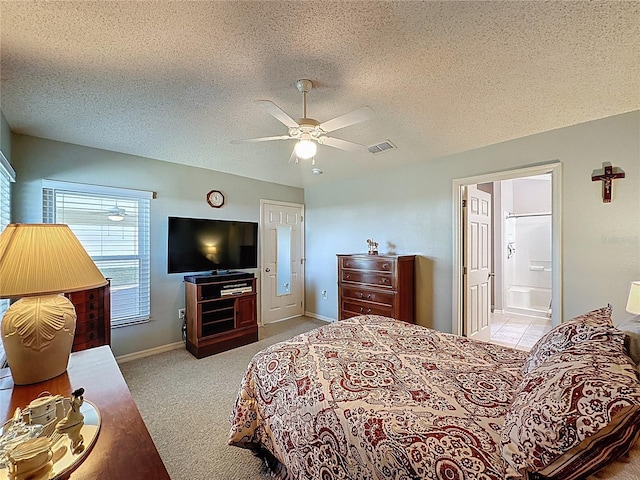 bedroom featuring baseboards, visible vents, carpet floors, ceiling fan, and a textured ceiling