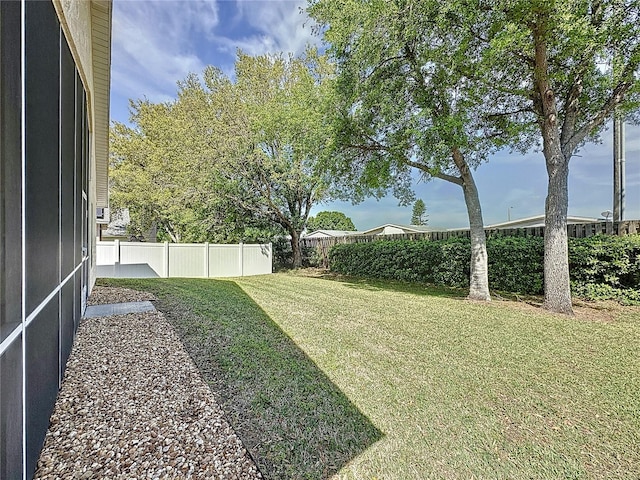 view of yard with a fenced backyard