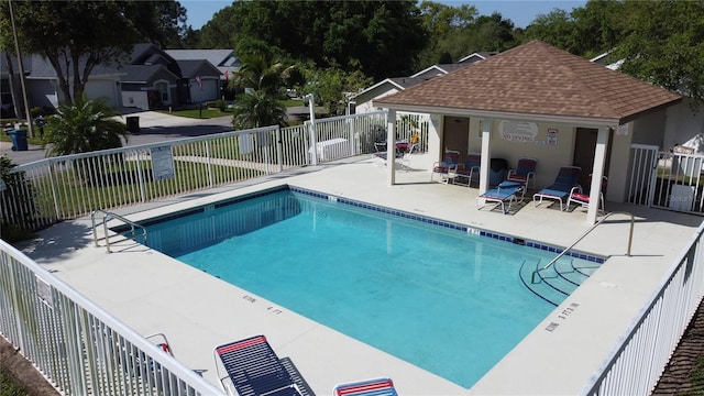 pool featuring a patio and fence