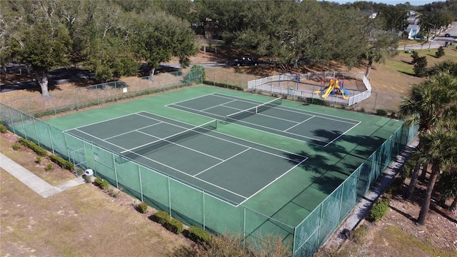 view of tennis court with fence