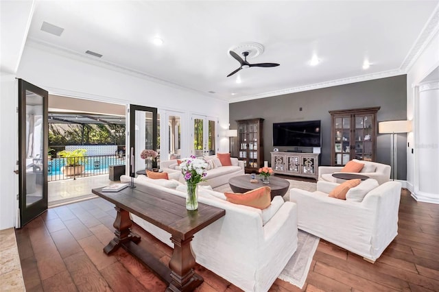 living area featuring dark wood-style floors, a ceiling fan, recessed lighting, ornamental molding, and french doors