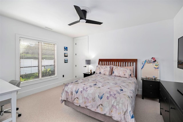 bedroom featuring a ceiling fan, carpet flooring, baseboards, and visible vents