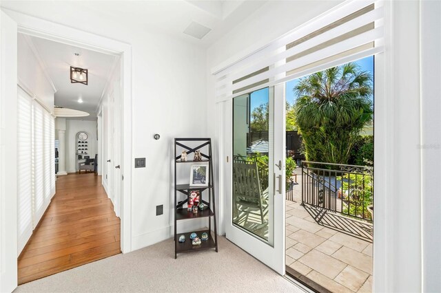 doorway to outside with carpet flooring and french doors