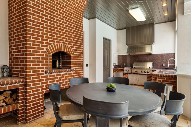 dining area with stone tile flooring and wooden ceiling