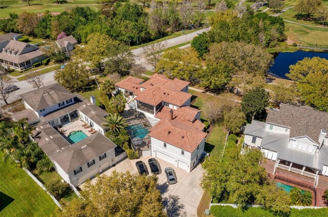 bird's eye view featuring a residential view and a water view