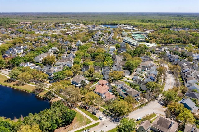 birds eye view of property featuring a water view and a residential view