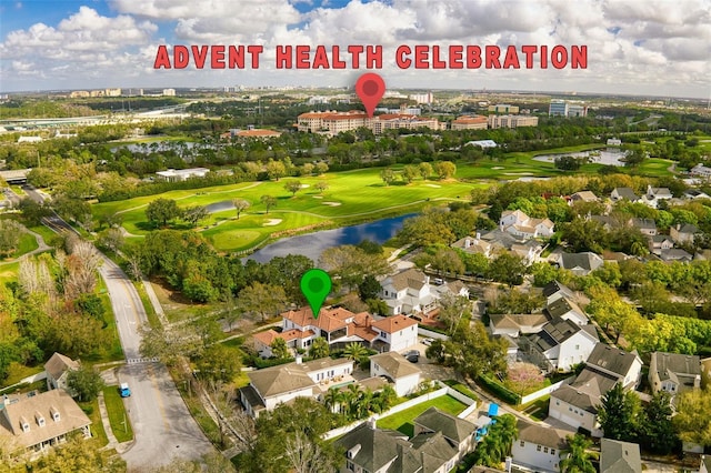 bird's eye view with view of golf course, a water view, and a residential view