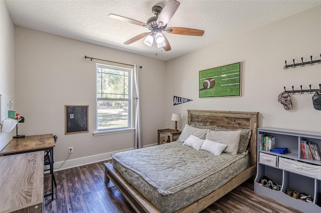 bedroom with ceiling fan, baseboards, a textured ceiling, and wood finished floors