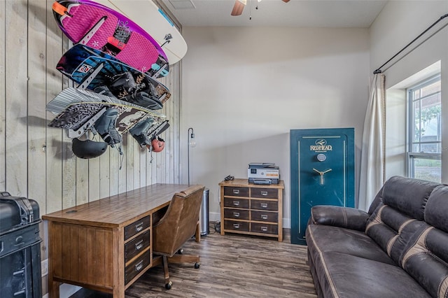 home office featuring wood finished floors and a ceiling fan