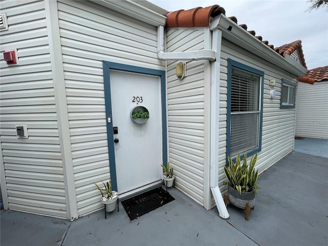 2560 Woodgate Blvd Unit 203, Orlando, FL 32822 - property entrance featuring a tiled roof