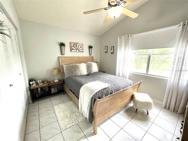 2560 Woodgate Blvd Unit 203, Orlando, FL 32822 - bedroom featuring lofted ceiling, ceiling fan, a closet, and a textured ceiling