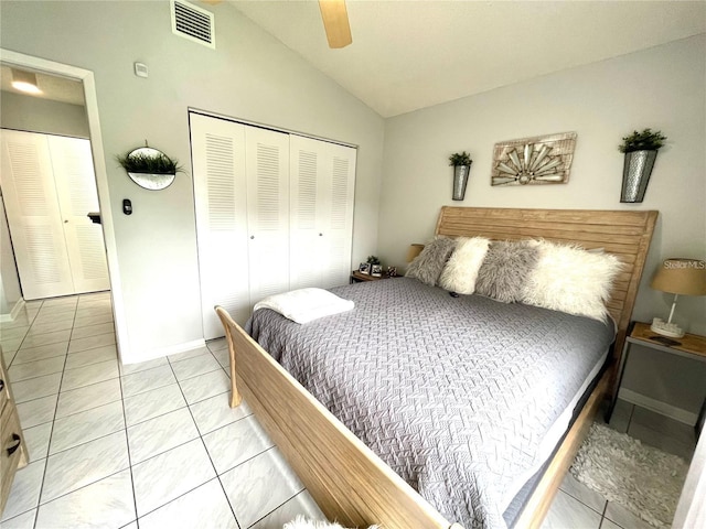2560 Woodgate Blvd Unit 203, Orlando, FL 32822 - bedroom featuring lofted ceiling, a closet, light tile patterned flooring, a ceiling fan, and baseboards