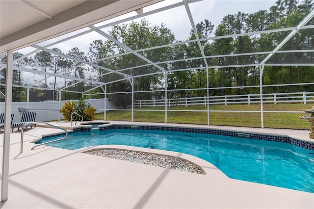 view of swimming pool with glass enclosure, a fenced backyard, a fenced in pool, and a patio area