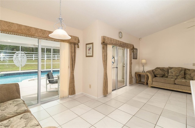 living room featuring light tile patterned floors and baseboards