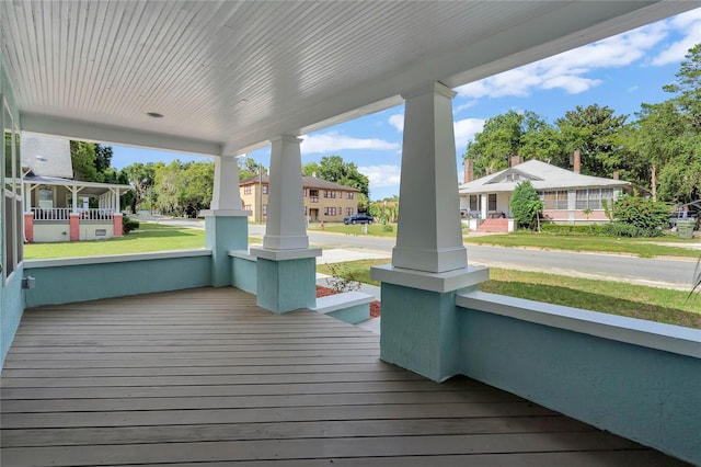 415 S 9th St, Leesburg, FL 34748 - deck with a residential view, covered porch, and a lawn