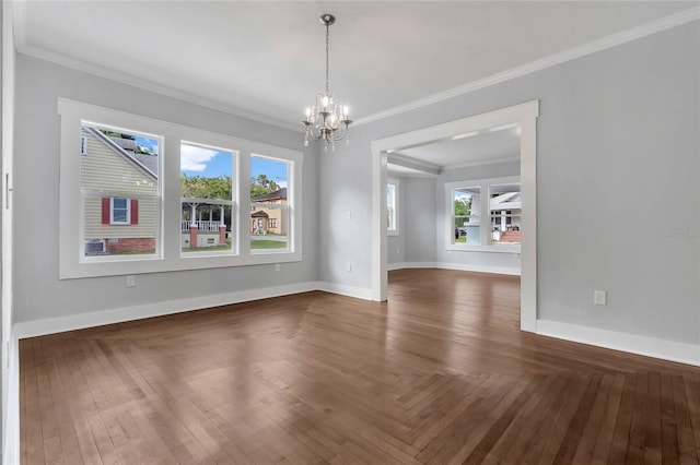 415 S 9th St, Leesburg, FL 34748 - empty room featuring crown molding, a chandelier, and a wealth of natural light
