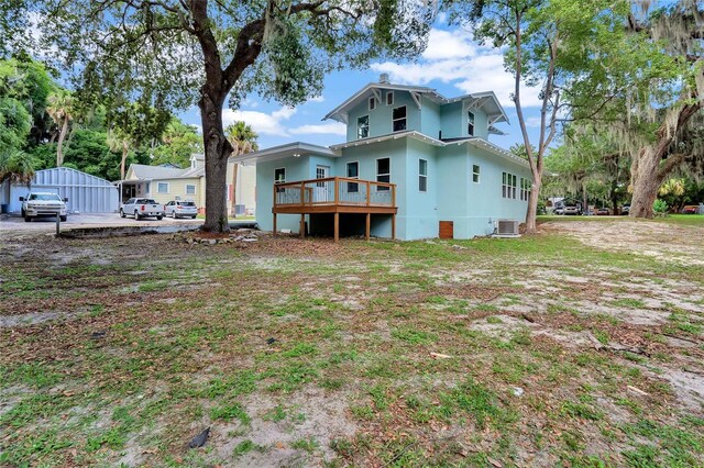 415 S 9th St, Leesburg, FL 34748 - back of property with central AC unit