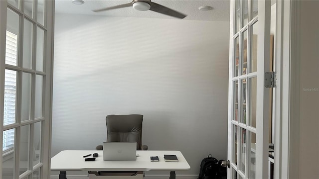 office space with french doors and ceiling fan