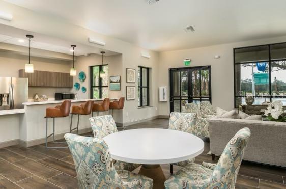 dining space with baseboards and wood finish floors