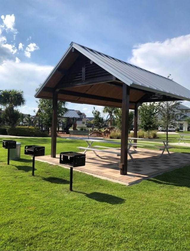 view of community with a gazebo and a lawn